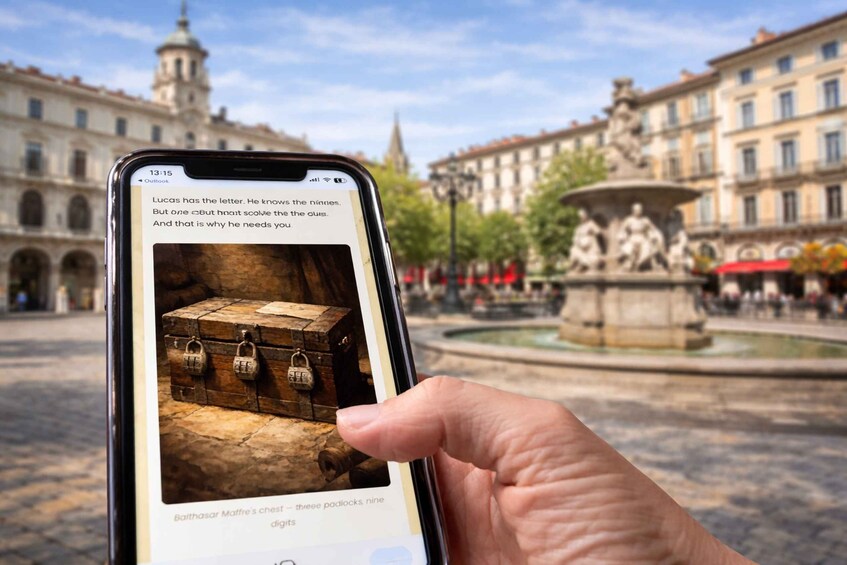 A smartphone displaying a photo of a chest with nine locks, held by a hand, with a historic plaza and a fountain in the background. 1