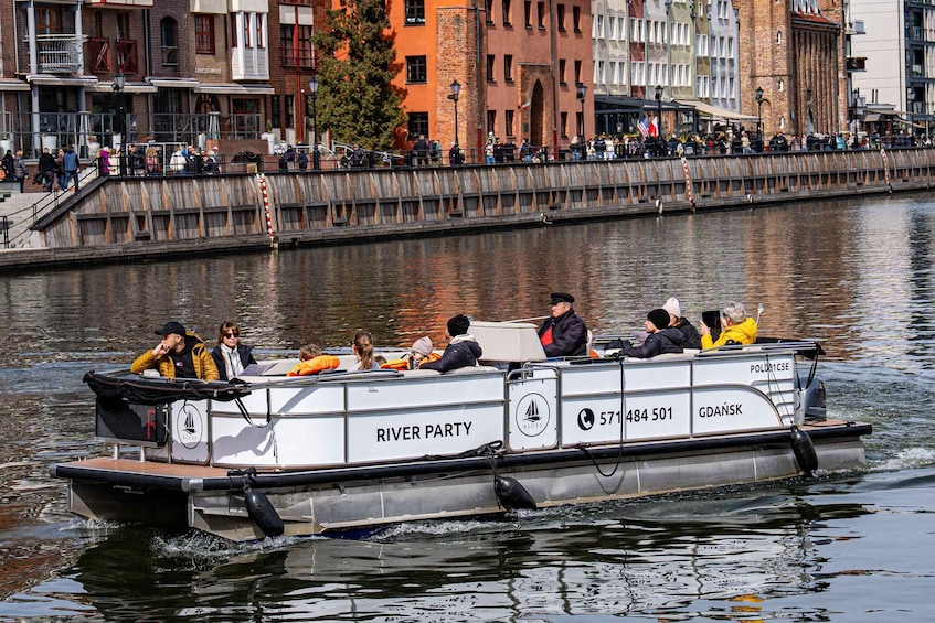 A river cruise boat named 'RIVER PARTY' with passengers enjoying the view. 5