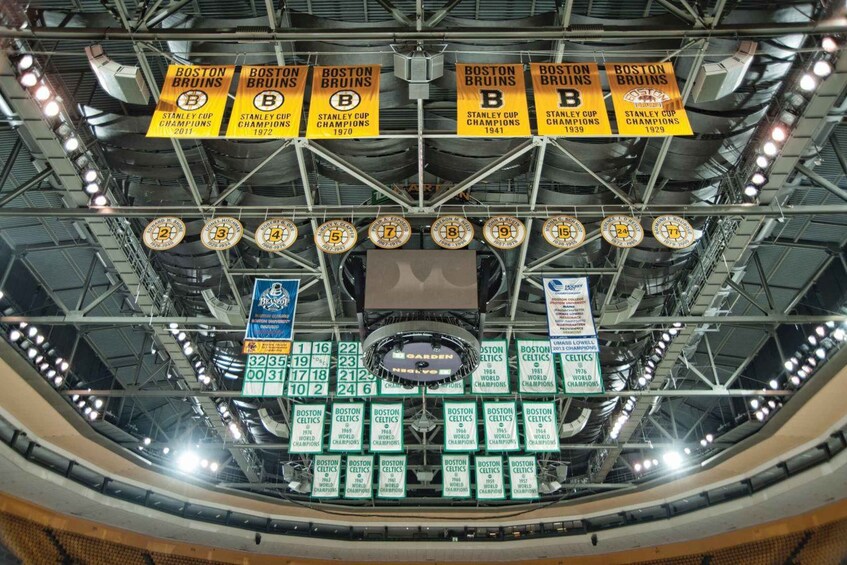 A sports arena with multiple banners and signs, including Stanley Cup Champions and World Champions. 3