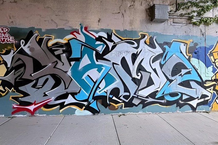 A wall with graffiti art. 5