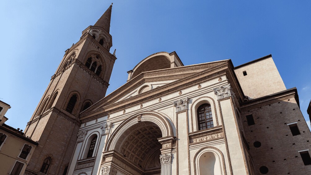 A historic church with a prominent bell tower and intricate architectural details. 3