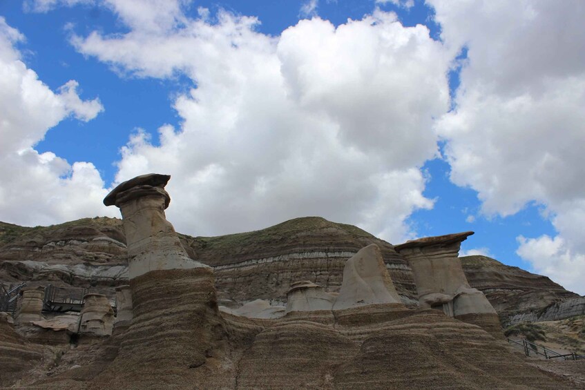 A landscape with prominent rock formations and a clear sky. 1