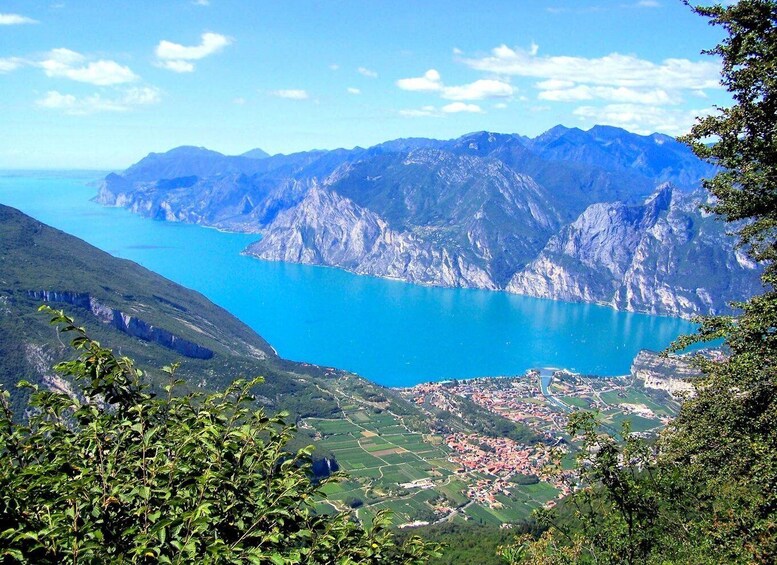 A mountainous landscape with a clear blue lake and a small village. 3
