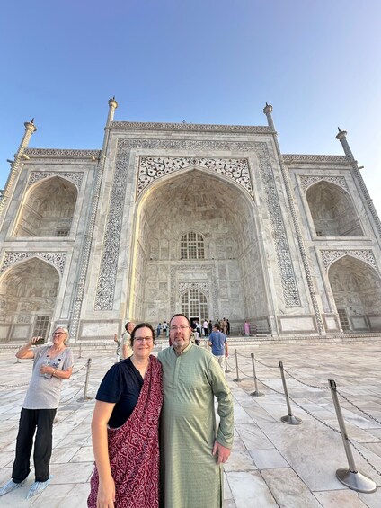 A large, ornate building with intricate carvings and a central archway. 4