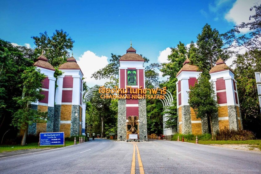 A road leading to a building with a sign reading 'CHANGMAI NIGHT SAFARI'. 4