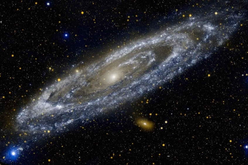 A spiral galaxy with a bright core and surrounding arms, set against a backdrop of stars and other celestial bodies. 4