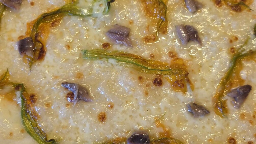 A close-up of a creamy dish with visible herbs and possibly meat. 3