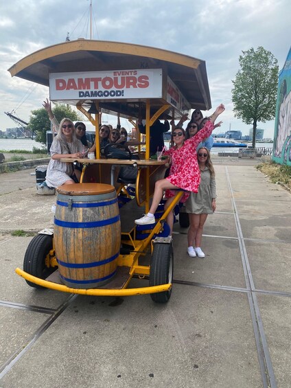 A group of people on a wooden cart with a sign reading 'DANTOURS DANGOOD!' 5
