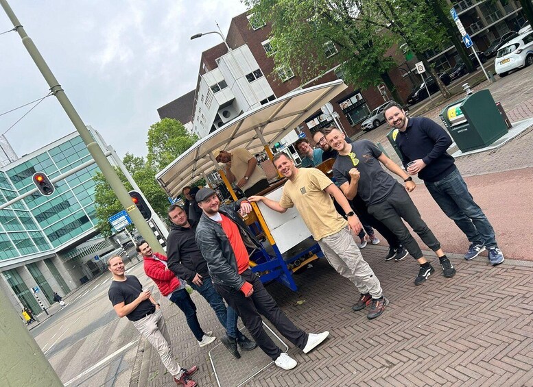 A group of people standing in front of a food truck on a city street. 4