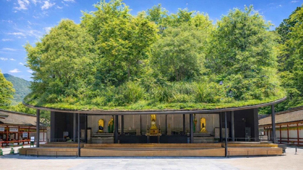 A temple with a green roof amidst lush trees. 5