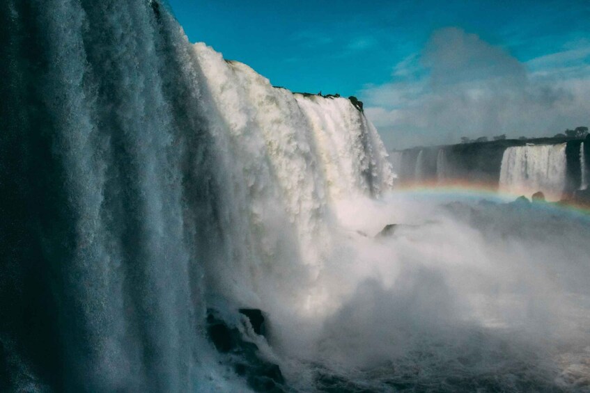 A large waterfall with a rainbow. 4