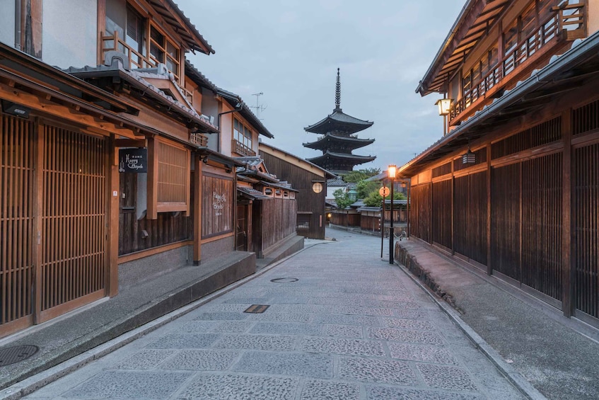 A traditional Japanese street with wooden buildings, a pagoda, and a sign for 'Merry Bicycle.' 5