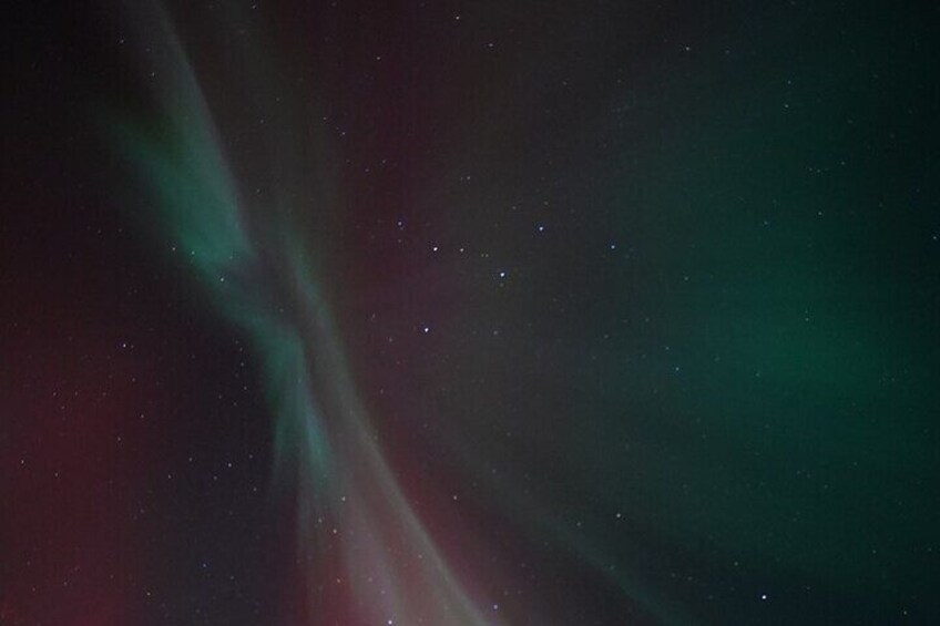 The aurora borealis with green and red hues. 3
