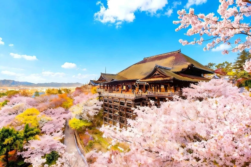 A traditional Japanese building surrounded by cherry blossoms. 1
