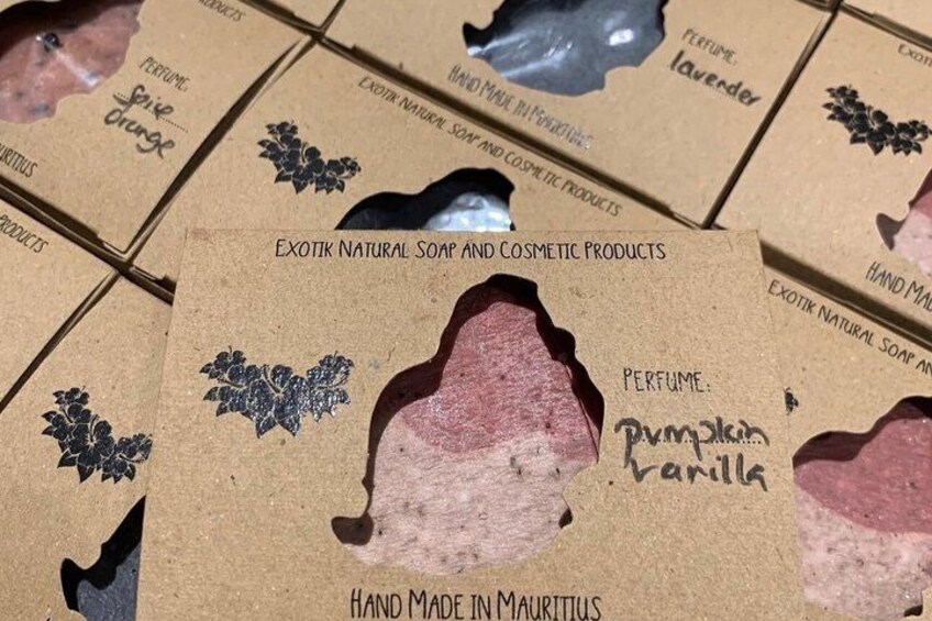 A cardboard box with a label for 'Exotik Natural Soap and Cosmetic Products,' including a 'Pumpkin Vanilla' perfume. 5