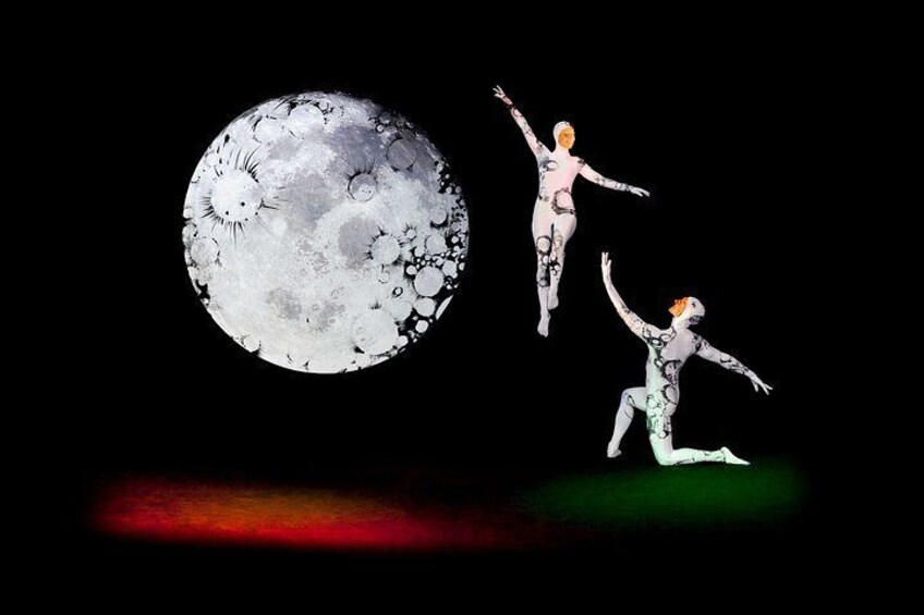 A large moon with craters and two figures in motion against a dark background. 4
