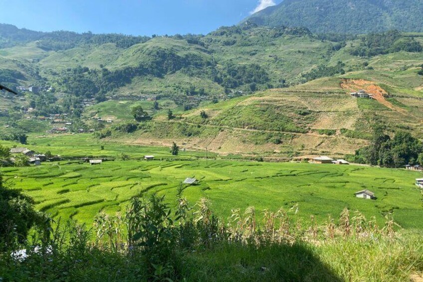 Terraced fields, houses, and a mountainous landscape. 3