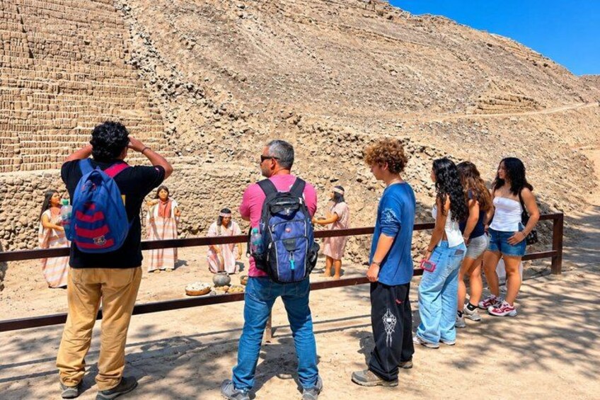 Tourists observing ancient ruins. 2
