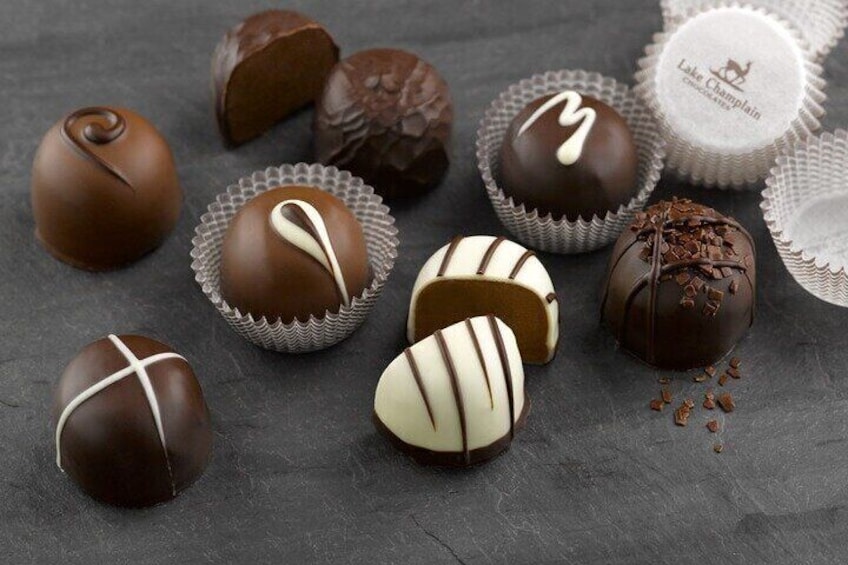 Assorted chocolate truffles in various shapes and designs. 2