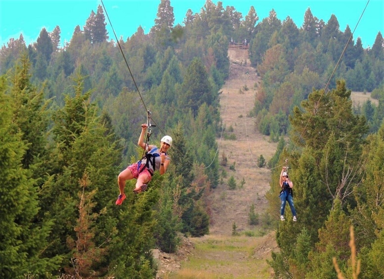 A person zip-lining through a forested area with a clear path ahead. 4
