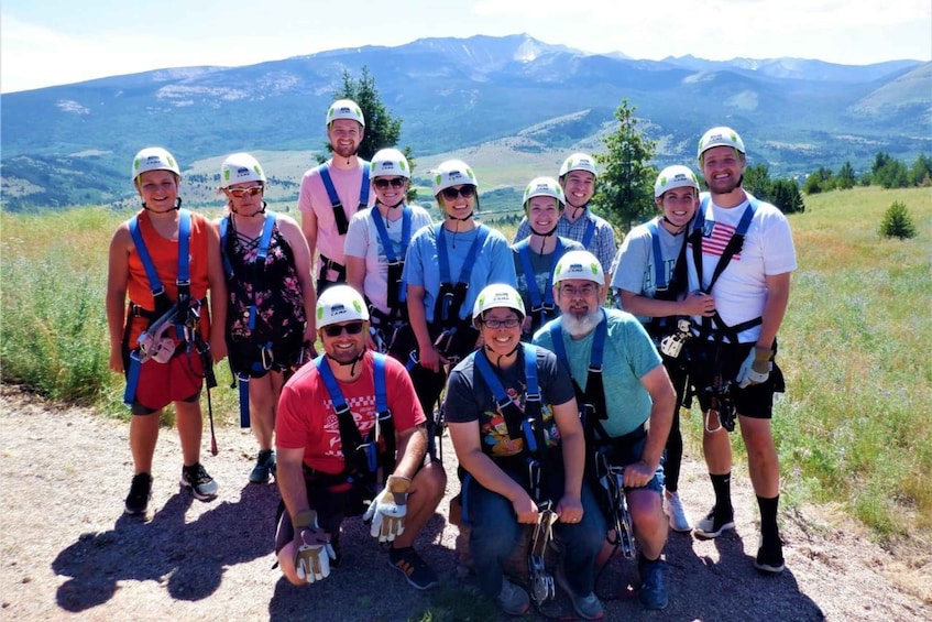 A group of people with helmets and harnesses on a mountain trail. 2