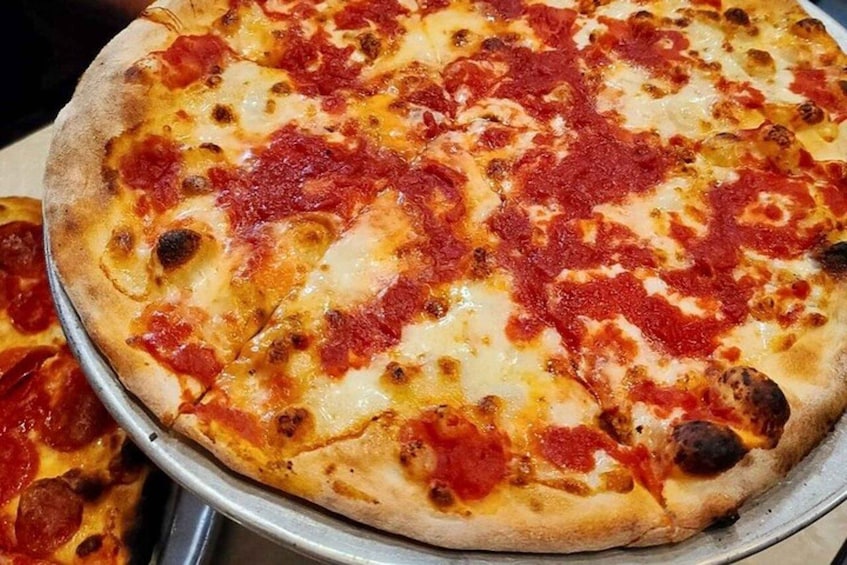 A pizza with melted cheese and tomato sauce. 3