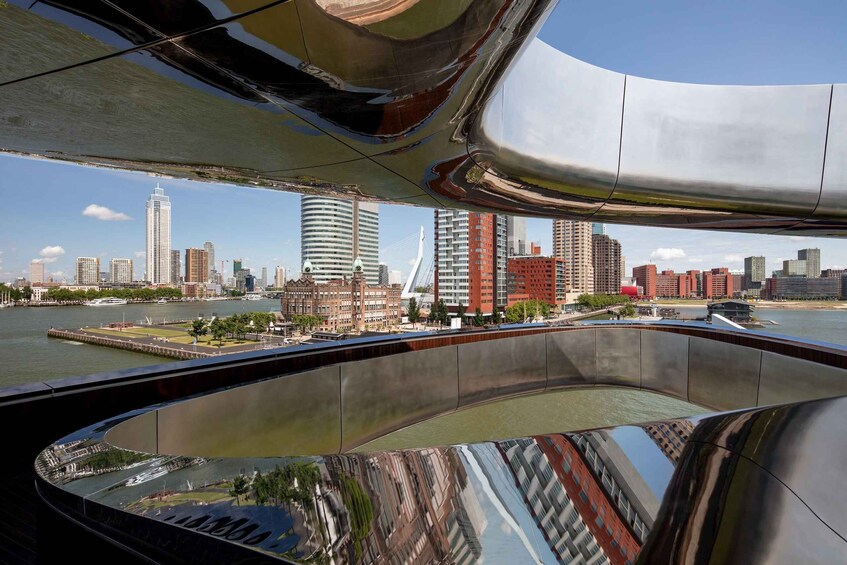 A modern cityscape with a river, high-rise buildings, and a distinctive bridge. 4