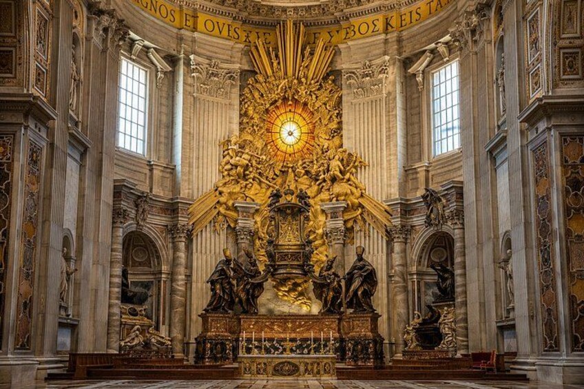 An ornate religious interior with a central golden altar, columns, and statues. 4