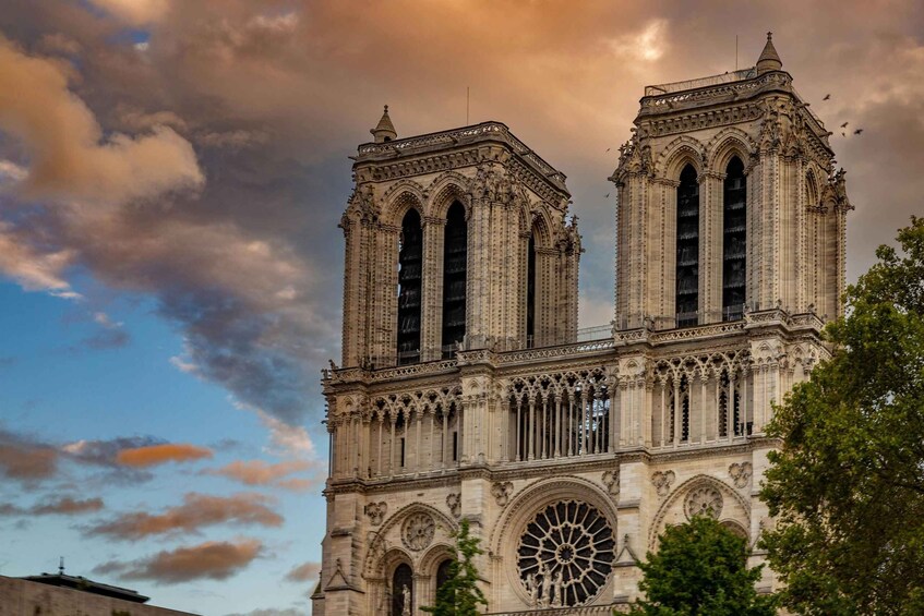 A historic cathedral with two prominent towers and a large rose window. 4