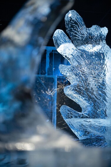 A large ice sculpture resembling a hand with a crystal structure. 4