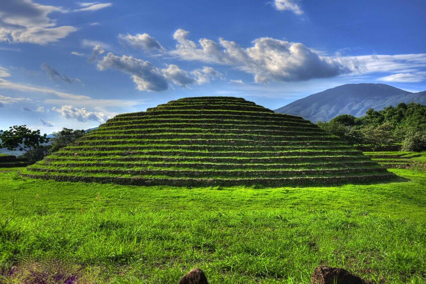Terraced fields with a mountain in the background. 1