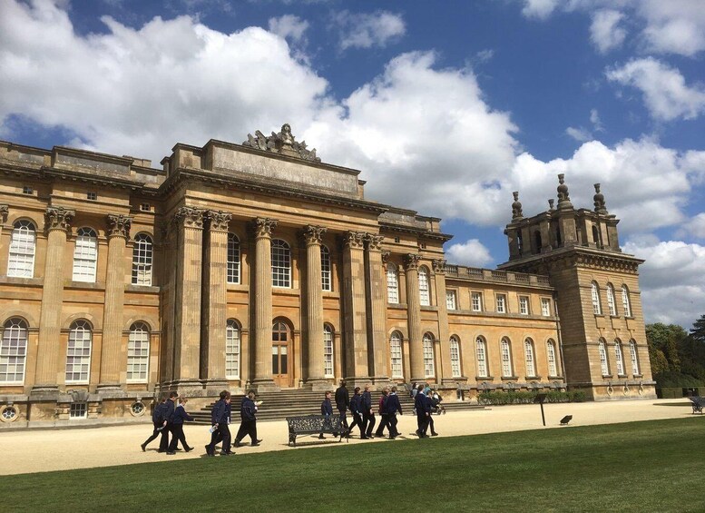 A large classical building with columns and a clock tower. 1
