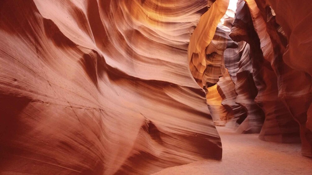 A canyon with smooth, curved rock formations. 5