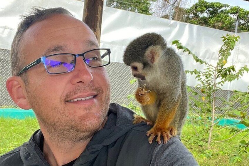 A person with a monkey on their shoulder. 5
