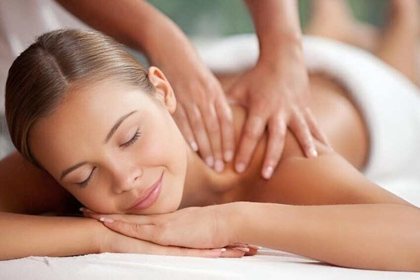 A person receiving a back massage. 1