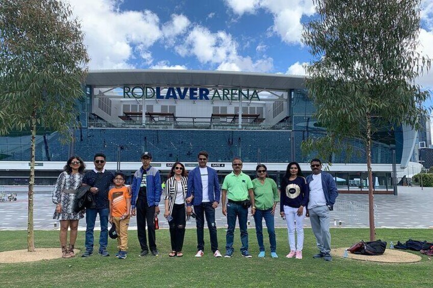 A group of people standing in front of a stadium with 'RODLAVERENA' written on it. 2