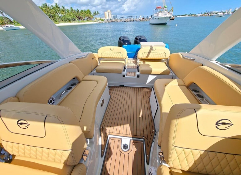 A boat's interior with beige leather seats and a wooden deck. 3