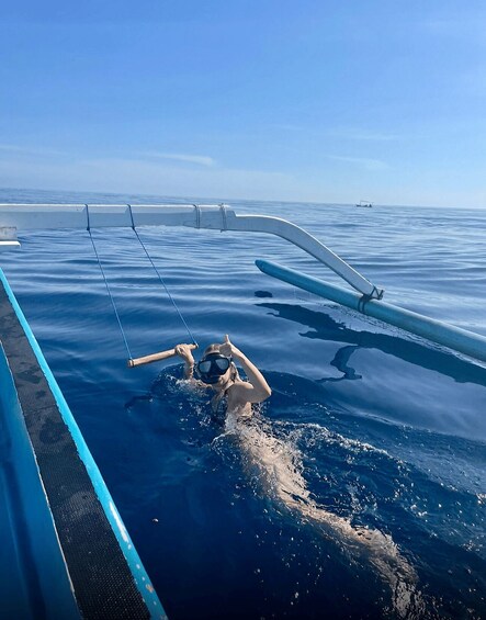 A person snorkeling in the ocean. 3