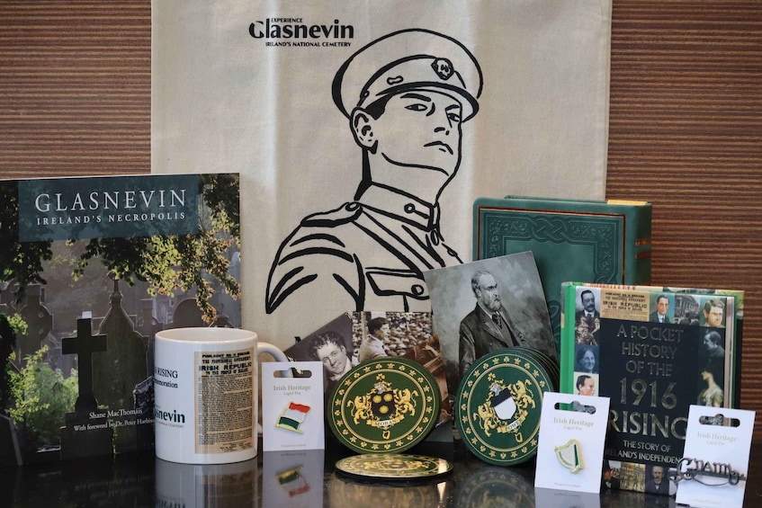 A display of Irish heritage items including books, a mug, and commemorative coins. 4