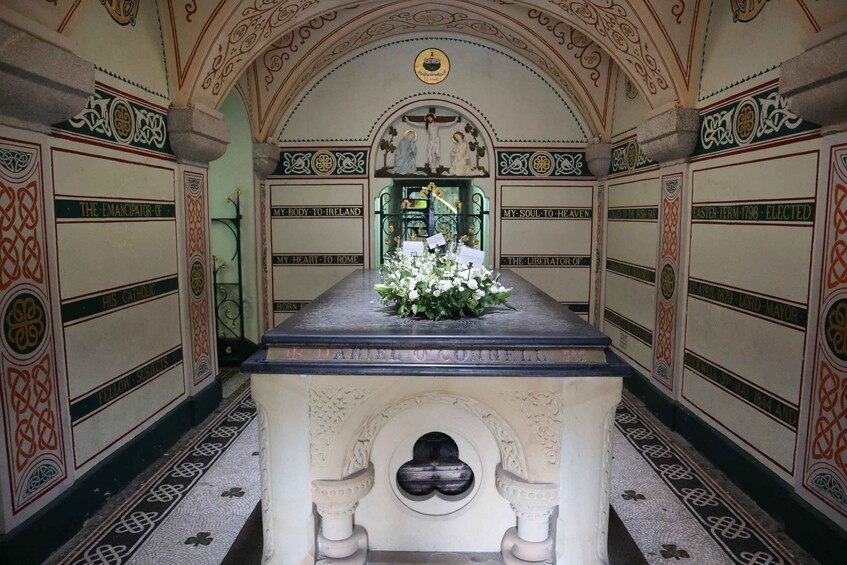 An ornate chapel interior with a central altar, floral arrangements, and intricate wall designs. 3