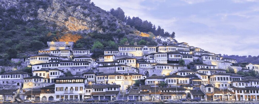 A terraced village with buildings built on hillside steps. 3