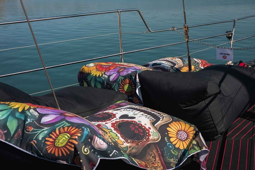 A boat's interior with colorful floral upholstery and a 'NO ENTRY' sign. 3