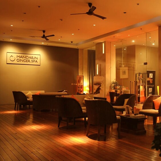 A modern interior with a wooden floor, seating area, ceiling fans, and a sign for 'MANDARIN GINGER SPA'. 5
