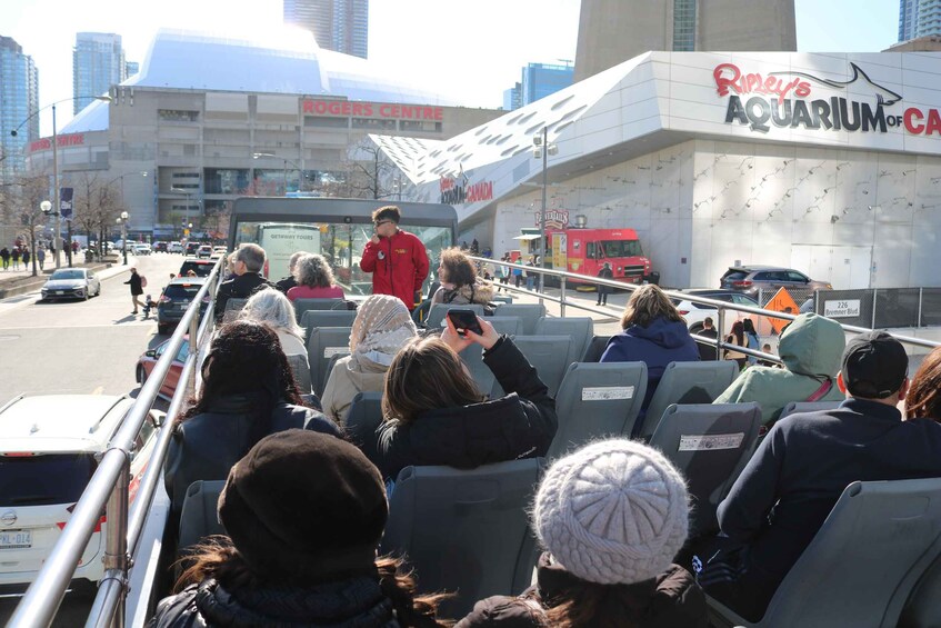 A group of people on a bus near Ripley's Aquarium of Canada. 5