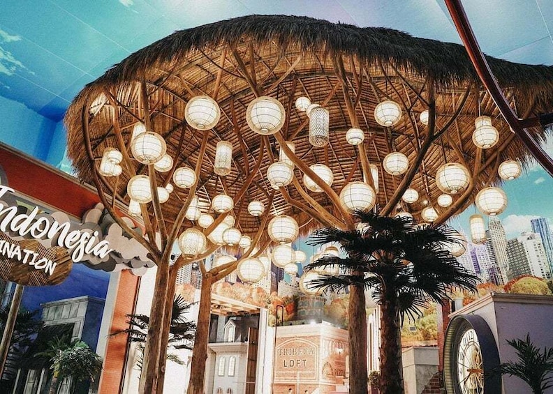 A thatched-roof structure with hanging lanterns, palm trees, and a sign reading 'Indonesia.' 1