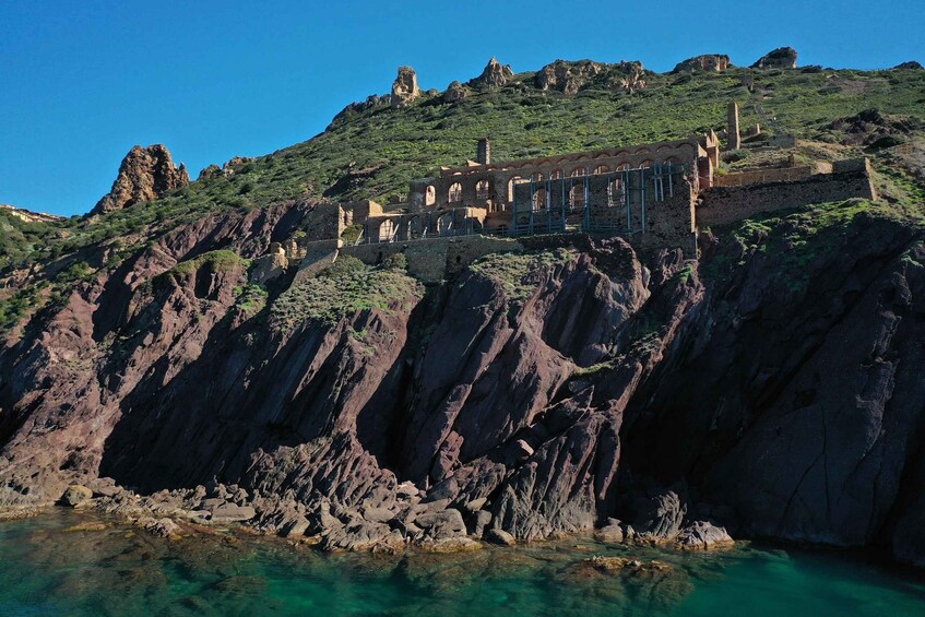 A coastal cliff with ruins and a castle on top. 3