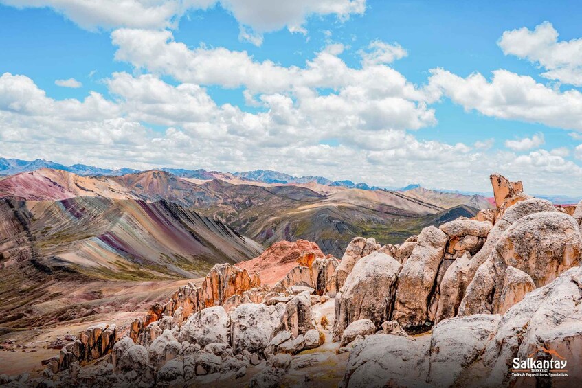 A mountainous landscape with rocky formations and a clear sky. 4