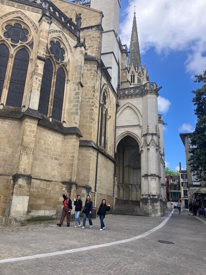 A historic church with Gothic architecture, including pointed arches and a spire. 5