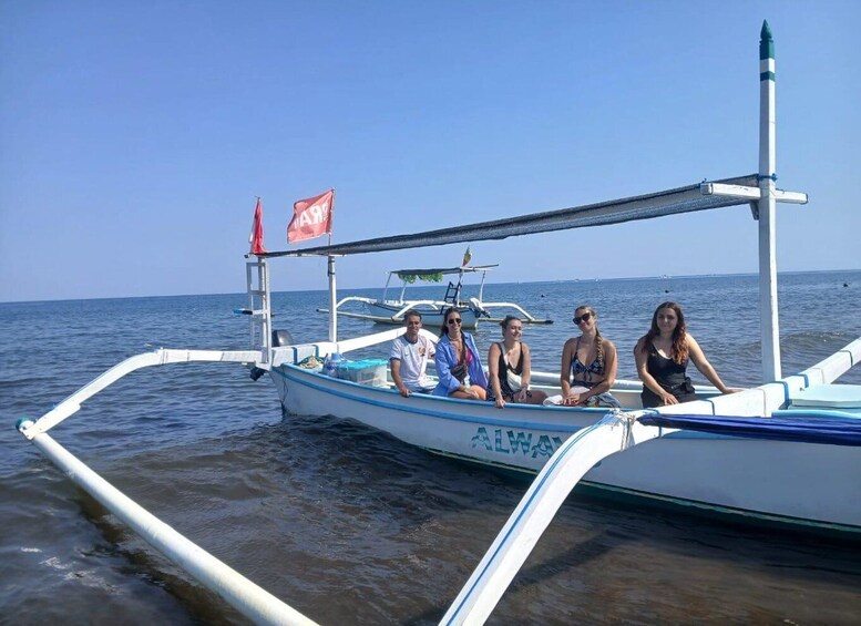 A boat with passengers on calm water. 1