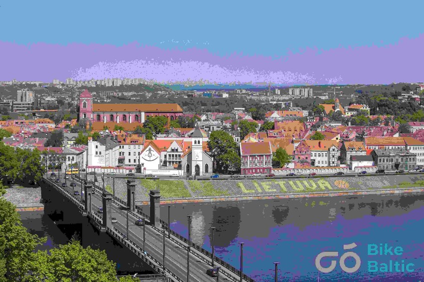 A coastal cityscape with a prominent bridge, historic buildings, and a clear view of the water. 5